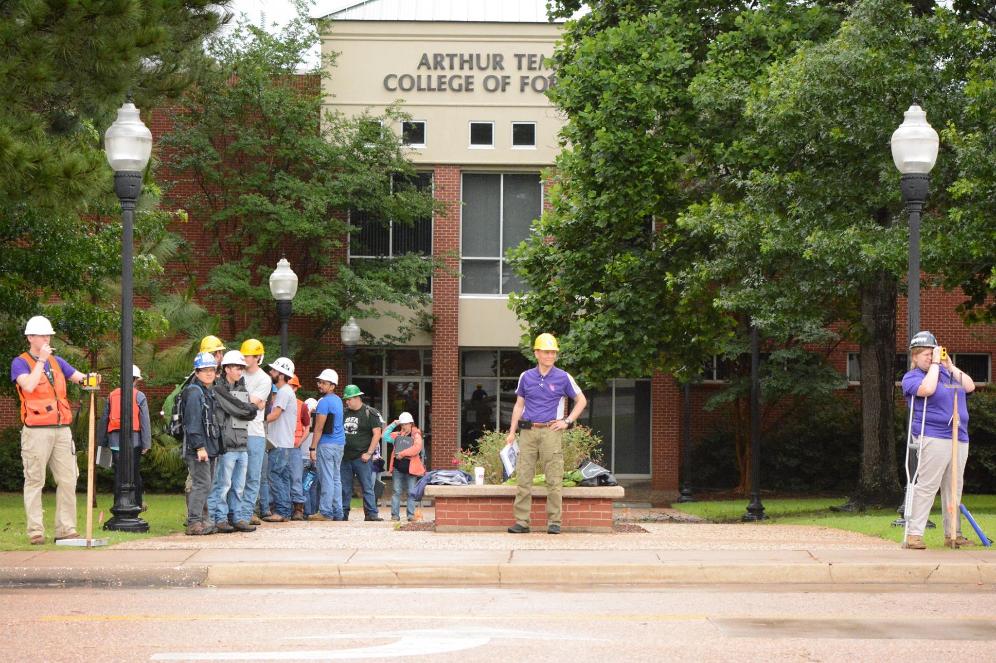 Dr. Hung conducts a field exercise in front of the Forestry Building at Stephen F. Austin State University. 